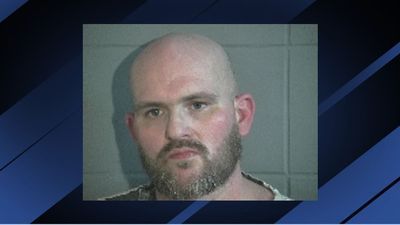 Image for story: Sheriff: Man arrested after large quantity of narcotics, cash, weapons found at home