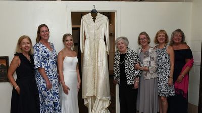 Image for story: 'Lucky dress' worn by 8 brides in the same family gets passed down to the next generation